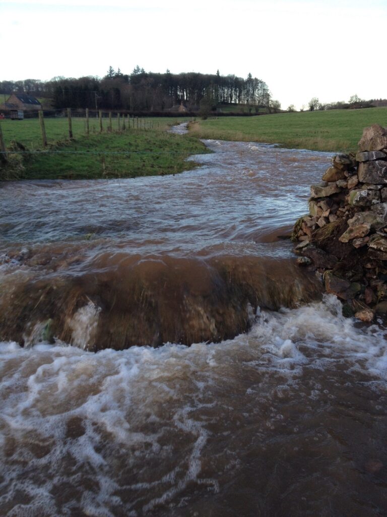 Flooding after Storm Desmond 2015 on the Blencow road just past Quirky Workshops.